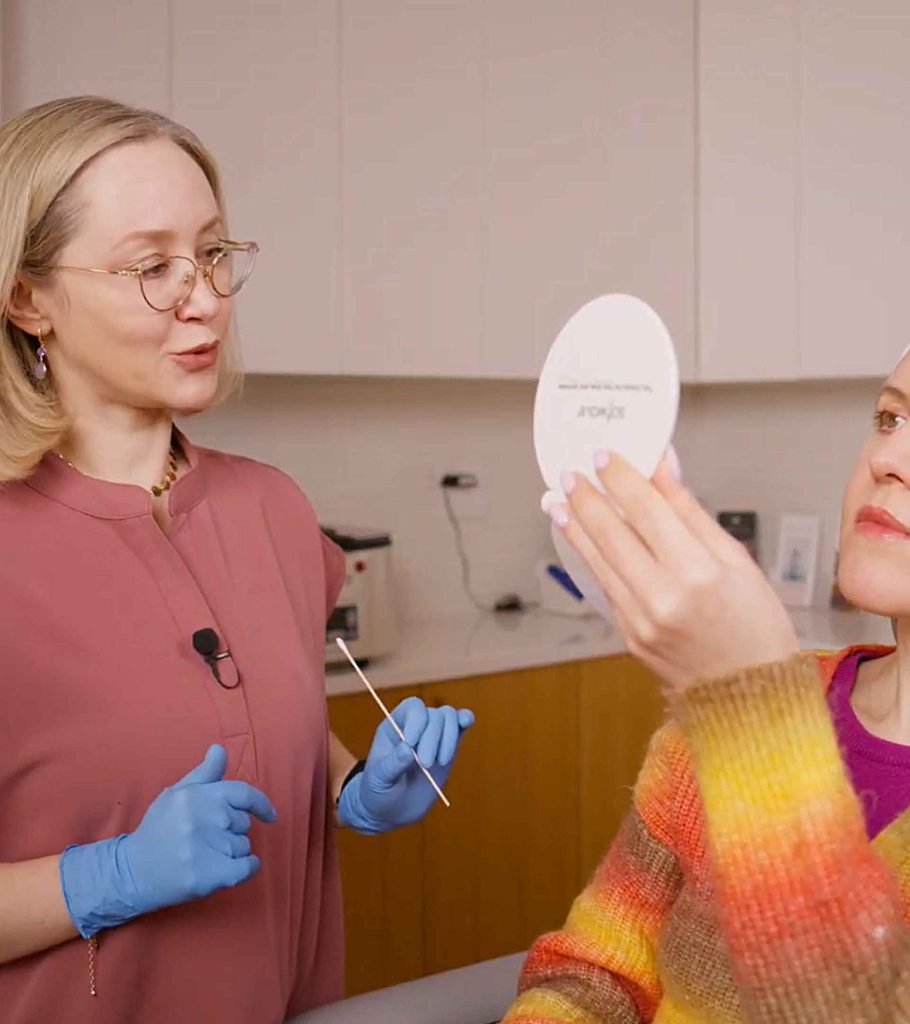 Dr. Kazlouskaya explaining treatment results to a patient during a cosmetic dermatology consultation at Dermatology Circle, Upper East Side New York