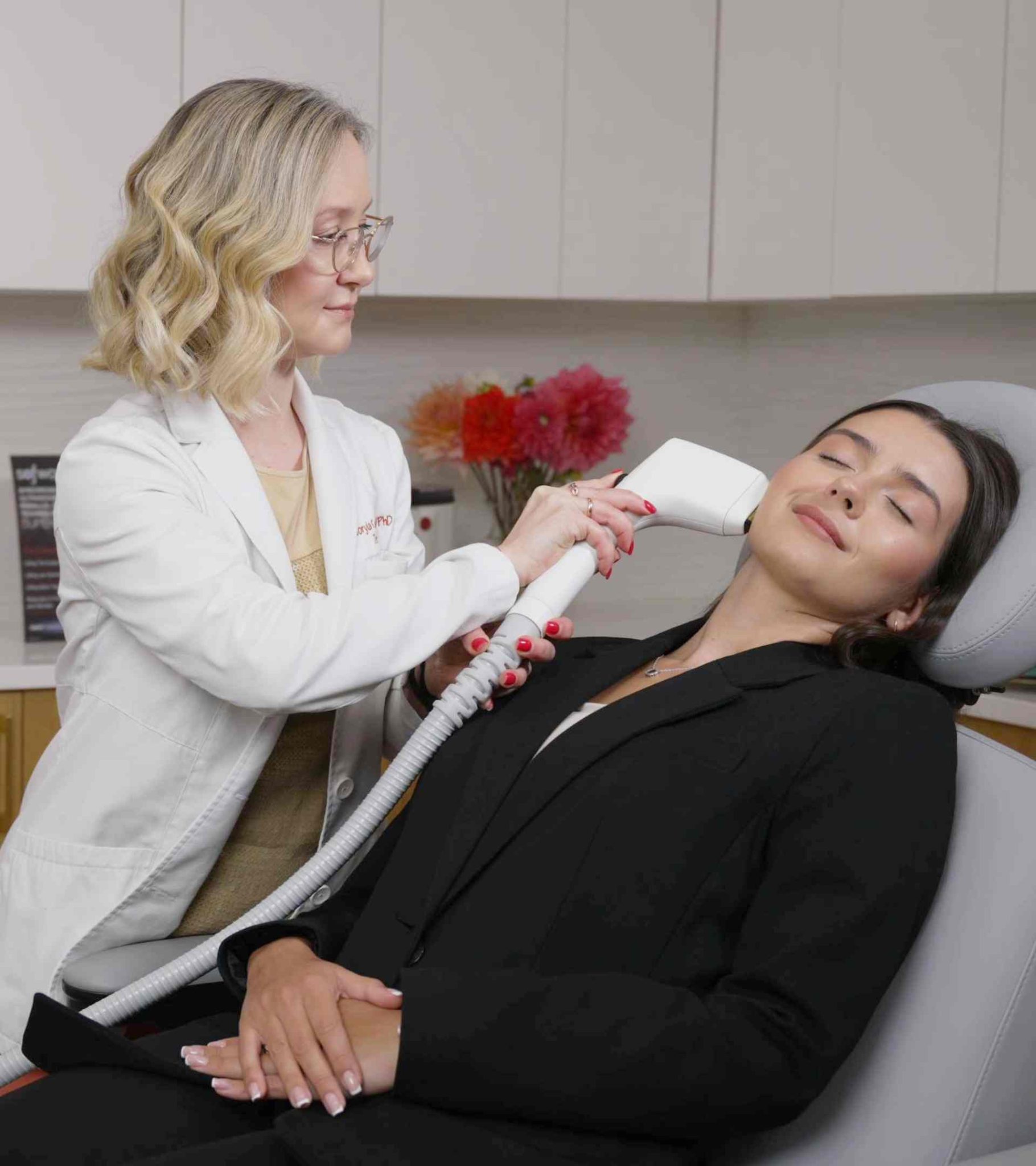Dr. Viktoryia Kazlouskaya performing Sofwave treatment of the jawline and neck at Dermatology Circle NYC
