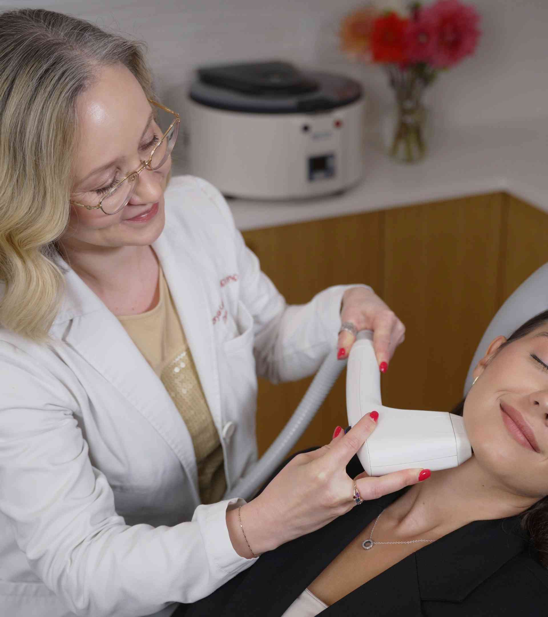 Dr. Viktoryia Kazlouskaya performing Sofwave neck treatment at Dermatology Circle in New York City