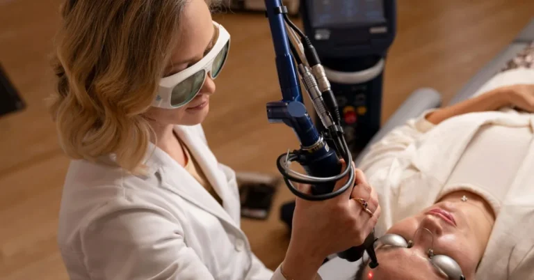Dermatologist performing fractional CO2 laser treatment on a patient’s face
