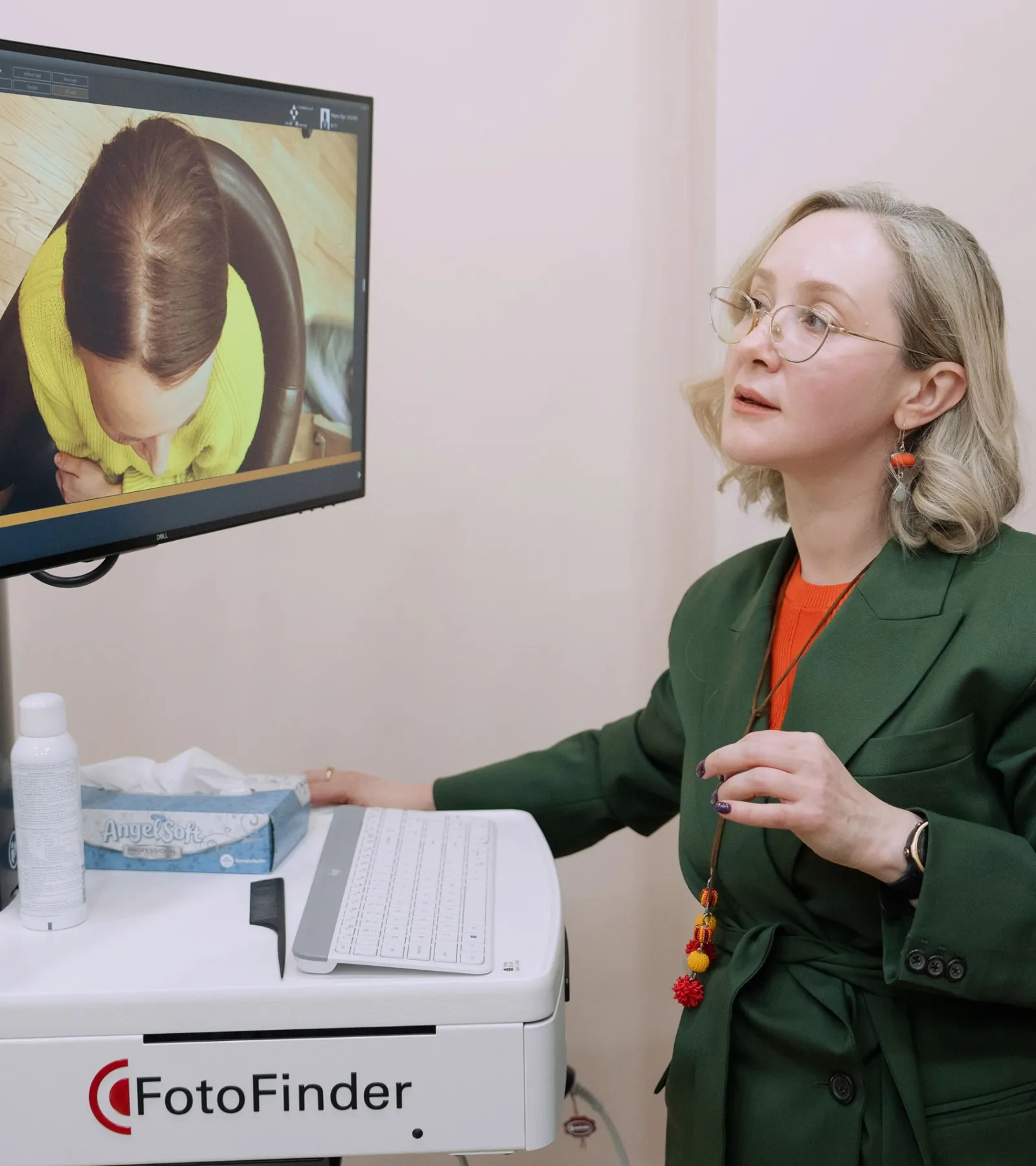 Dr. Viktoryia Kazlouskaya performing a FotoFinder hair loss consultation at Dermatology Circle NYC